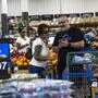 FILE - Shoppers pause in the produce section at a Walmart Superstore in Secaucus, New Jersey, July 11, 2024. (AP Photo/Eduardo Munoz Alvarez, File)