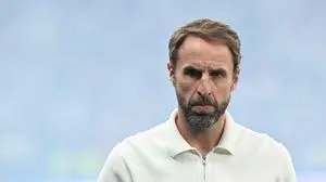 (FILES) England's head coach Gareth Southgate looks on ahead of the UEFA Euro 2024 final football match between Spain and England at the Olympiastadion in Berlin on July 14, 2024. Gareth Southgate said he is resigning as England manager on July 16, 2024 two days after they lost to Spain in the Euro 2024 final. "It's time for change, and for a new chapter. Sunday's final in Berlin against Spain was my final game as England manager," he said in statement. (Photo by INA FASSBENDER / AFP)