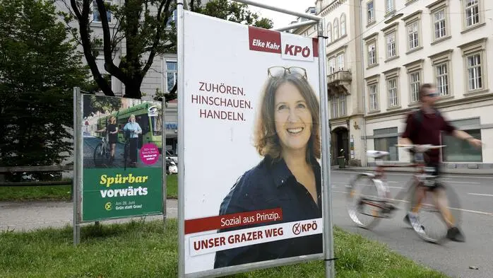 Wahlplakate der Grazer Grünen (links) und KPÖ zur Graz-Wahl am 28. Juni 2026
