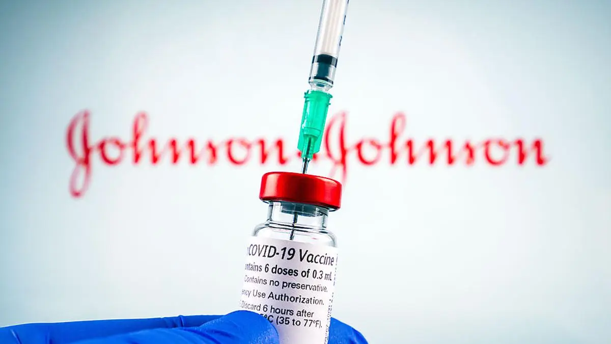 Johnson and johnson logo and covid-19 coronavaccine injection vial, sterile glass with label and syringe. Healthcare theme.