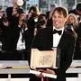 US director Sean Baker poses with the trophy during a photocall after he won the Palme d'Or for the film "Anora" during the Closing Ceremony at the 77th edition of the Cannes Film Festival in Cannes, southern France, on May 25, 2024. (Photo by LOIC VENANCE / AFP)
