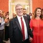 Britain's incoming Prime Minister and leader of the Labour Party, Keir Starmer, and his wife Victoria, are greeted as they arrive inside 10 Downing Street, the official residence of Britain's Prime Minister, in London on July 5, 2024, a day after Britain held a general election. Starmer became Britain's new prime minister, as his centre-left opposition Labour party swept to a landslide general election victory, ending 14 years of right-wing Conservative rule. (Photo by Stefan Rousseau / POOL / AFP)