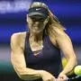 Maria Sharapova of Russia returns the ball to Serena Williams of the United Sates during their Round 1 women's Singles match at the 2019 US Open at the USTA Billie Jean King National Tennis Center in New York on August 26, 2019 (Photo by Kena Betancur / AFP)