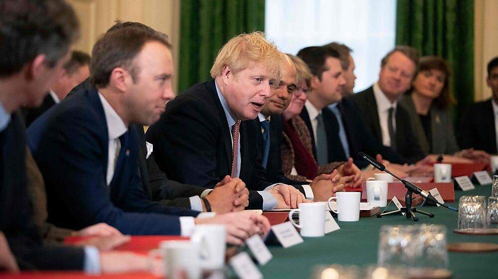 Premierminister Boris Johnson (Mitte) und sein Team 