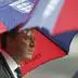 England's manager Steve McClaren shelters under an umbrella before the Euro 2008 group E qualifying soccer match between England and Croatia at Wembley Stadium in London, Wednesday Nov. 21, 2007.  (AP Photo/Tom Hevezi)