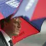 England's manager Steve McClaren shelters under an umbrella before the Euro 2008 group E qualifying soccer match between England and Croatia at Wembley Stadium in London, Wednesday Nov. 21, 2007.  (AP Photo/Tom Hevezi)