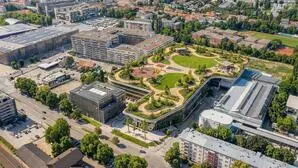 Rendering einer Überbauung des Obi-Parkplatzes in der Conrad-von-Hötzendorf-Straße mit neuer Parkgarage und begrüntem Dach