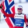 TRONDHEIM,NORWAY,06.MAR.25 - NORDIC SKIING, CROSS COUNTRY SKIING - FIS Nordic World Ski Championships, 4x7.5 km relay, men. Image shows Johannes Hoesflot Klaebo (NOR) with a flag.
Photo: GEPA pictures/ Harald Steiner