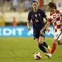 France's Adrien Rabiot, left, duels for the ball with Croatia's Luka Modric during the UEFA Nations League soccer match between Croatia and France at the Poljud stadium, in Split, Croatia, Monday, June 6, 2022. (AP Photo/Darko Bandic)
