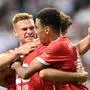 (LtoR) Bayern Munich's German midfielder Joshua Kimmich, Bayern Munich's German forward Thomas Mueller, and Bayern Munich's German midfielder Jamal Musiala celebrate after Musiala scored the 4-0 goal during the German first division Bundesliga football match between Eintracht Frankfurt and FC Bayern Munich in Frankfurt am Main, western Germany on August 5, 2022. (Photo by CHRISTOF STACHE / AFP) / DFL REGULATIONS PROHIBIT ANY USE OF PHOTOGRAPHS AS IMAGE SEQUENCES AND/OR QUASI-VIDEO