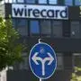 (FILES) In this file photo taken on June 24, 2020, a traffic sign stands in front of the headquarters of German payments provider Wirecard in Aschheim near Munich, southern Germany. - Germany's finance and economy ministers will be grilled by lawmakers on July 29, 2020 about the massive fraud scandal that brought down payments provider Wirecard, amid criticism that authorities failed to act on early warning signs. (Photo by Christof STACHE / AFP)