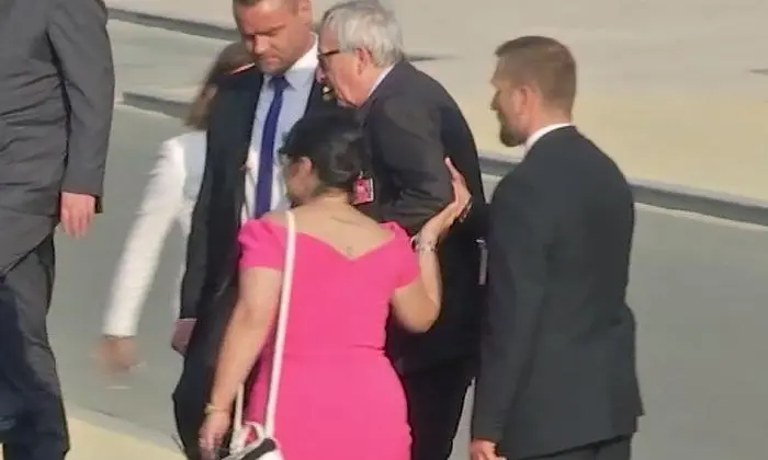 In this Wednesday, July 11, 2018 grab taken from video, European Union leader Jean-Claude Juncker is helped up the stairs, as he joins Heads of State and NATO leaders at Brussels Parc Cinquantenaire, in Brussels, Belgium. The European Union leader was seen stumbling, walking ungainly and losing his balance several times ahead of a gala dinner late Wednesday.  Juncker has said he suffers from sciatica that sometimes affects his movements. (AP)