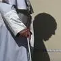 (FILES) The shadow of Pope Francis casts a silhouette on his armchair as he arrives for the weekly general audience at St Peter's square in The Vatican on September 27, 2023. The Vatican said on April 24, 2025, that nearly 50,000 people had so far paid their respects to Pope Francis, whose body is lying in state at St Peter's Basilica for three days before his funeral, which is set for April 26 morning. (Photo by Filippo MONTEFORTE / AFP)