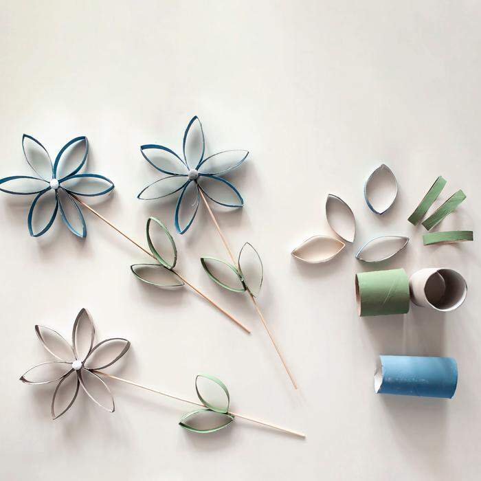 Flowers from toilet roll tube for Mother Day, zero waste crafts for kids, school and kindergarten, creative seasonal idea for holidays and leisure, plain neutral pastel background