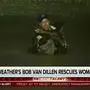 In this image made from a Fox Weather broadcast, meteorologist Bob Van Dillen rescues a woman stuck in floodwaters caused by Hurricane Helene in Atlanta, Friday, Sept. 27, 2024. (Fox Weather via AP)