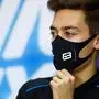 Williams' British driver George Russell adjusts his mask during the presser ahead of the Bahrain Formula One Grand Prix at the Bahrain International Circuit in the city of Sakhir on November 26, 2020. (Photo by Rudy Carezzevoli / FIA / AFP) / RESTRICTED TO EDITORIAL USE - MANDATORY CREDIT "AFP PHOTO / FIA / RUDY CAREZZEVOLI - NO MARKETING NO ADVERTISING CAMPAIGNS - DISTRIBUTED AS A SERVICE TO CLIENTS