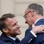 France's President Emmanuel Macron (L) welcomes Germany's newly elected Chancellor Friedrich Merz (R) at the Elysee presidential palace in Paris on May 7, 2025. Merz visits France and Poland on May 7, on a mission to boost ties with the European neighbours in turbulent times. (Photo by Ludovic MARIN / AFP)