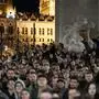 People listen to the speech of former Hungarian government insider Peter Magyar next to Kossuth Square on Tuesdy, in Budapest, Hungary, March 26, 2024. Magyar on Tuesday released a recording that he claims proves senior officials in the government of Prime Minister Viktor Orban manipulated court documents to cover up their involvement in a corruption case. (AP Photo/Denes Erdos)