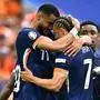 Netherlands' forward #11 Cody Gakpo celebrates scoring the opening goal with his teammates during the UEFA Euro 2024 round of 16 football match between Romania and the Netherlands at the Munich Football Arena in Munich on July 2, 2024. (Photo by Fabrice COFFRINI / AFP)