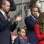 Britain's Prince William, Kate, Duchess of Cambridge and their son Prince George applaud before the start of the Euro 2020 soccer championship round of 16 match between England and Germany at Wembley stadium in London, Tuesday, June 29, 2021. (AP Photo/Frank Augstein, Pool)