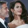George Clooney, left, and Amal Clooney pose for photographers upon arrival at the premiere of the film 'The 'Tender Bar' during the 2021 BFI London Film Festival in London, Sunday, Oct. 10, 2021. (Photo by Joel C Ryan/Invision/AP)