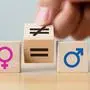 BILD zu OTS - Concepts of gender equality. Hand flip wooden cube with symbol unequal change to equal sign