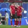 Austria's Michael Gregoritsch comforts Austria's Alexander Prass after a round of sixteen match between Austria and Turkey at the Euro 2024 soccer tournament in Leipzig, Germany, Tuesday, July 2, 2024. (AP Photo/Andreea Alexandru)