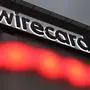 The logo of German payments provider Wirecard is seen at a building of the company's headquarters in Aschheim near Munich, southern Germany, on September 2, 2020. - Germany is poised to launch a full parliamentary inquiry into the collapse of payments provider Wirecard, as questions mount on how the government failed to prevent the country's biggest post-war financial scandal. After grilling members of Chancellor Angela Merkel's cabinet behind closed doors, opposition lawmakers on parliament's finance committee said they have no choice but to up the ante and seek a full inquiry. (Photo by Christof STACHE / AFP)
