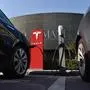 (FILES) In this file photo taken on September 12, 2017 Tesla cars charge at a Tesla charging station outside a shopping mall in Beijing.
Tesla chief executive Elon Musk said August 7, 2018 he would remain CEO of the electric automaker even if it ceases to be publicly traded. Trading in the company's shares were suspended mid-afternoon following Musk's suggestion that it could go private. Before that, they had surged by more than seven percent."No change," Musk replied to a Twitter user who asked whether he would like to stay on in his current position. / AFP PHOTO / GREG BAKER