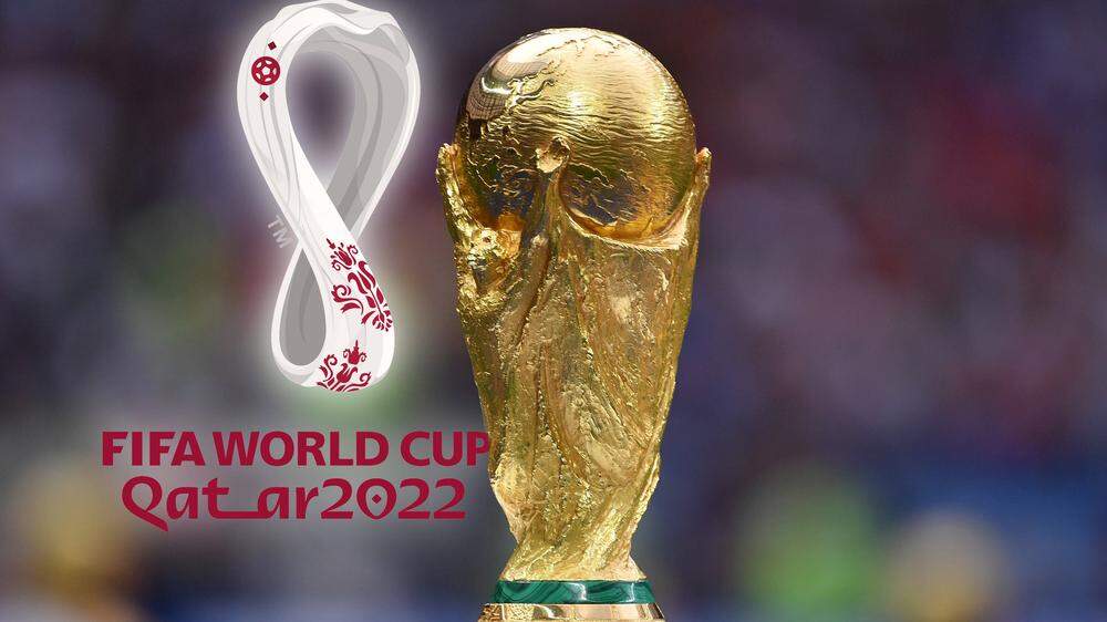 FOTOMONTAGE: FIFA WM 2022-Auslosung der Gruppen am 01.04.2022 in Doha. WM Pokal,Cup,Trophaee,Sachaufnahme mit dem Logo,