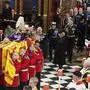 The coffin of Queen Elizabeth II is carried into Westminster Abbey, followed by King Charles III, Camilla, the Queen Consort, Princess Anne, Vice Admiral Sir Tim Laurence, Prince Andrew, Prince Edward, Sophie, the Countess of Wessex, Prince William, Catherine, the Princess of Wales, Prince George, Princess Charlotte, Prince Harry, Meghan, the Duchess of Sussex and Peter Phillips for the funeral service of Queen Elizabeth II at Westminster Abbey in central London, Monday Sept. 19, 2022. The Queen, who died aged 96 on Sept. 8, will be buried at Windsor alongside her late husband, Prince Philip, who died last year. (Dominic Lipinski/Pool via AP)