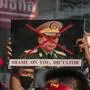 February 1, 2021, Bangkok, Thailand: NLD supporter holds a crossed-out portrait of Myanmar s army chief Min Aung Hlaing during the demonstration..National League for Democracy NLD supporters and Thai anti-Coup protesters rally outside Myanmar s embassy after the Myanmar military seized power from a democratically elected civilian government and arrested its leader Aung San Suu Kyi. The Thai riot police later dispersed the demonstrators. Bangkok Thailand - ZUMAs197 20210201_zaa_s197_156 Copyright: xPeeraponxBoonyakiatx 