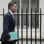Britain's Chancellor Jeremy Hunt leaves 11 Downing Street to attend Parliament in London, Thursday, Nov. 17, 2022. Just three weeks after taking office, British Prime Minister Rishi Sunak faces the challenge of balancing the nation's budget while helping millions of people slammed by a cost-of-living crisis. Treasury chief Jeremy Hunt will deliver the government's plan for tackling a sputtering economy in a speech to the House of Commons on Thursday. (AP Photo/Alastair Grant)