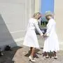 Britain's Queen Camilla and Brigitte Macron lay flowers during the UK Ministry of Defence and the Royal British Legion's commemorative event at the British Normandy Memorial to mark the 80th anniversary of D-Day, in Ver-Sur-Mer, France, Thursday, June 6, 2024. (Chris Jackson, Pool Photo via AP)