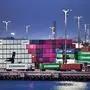 Container trucks make their way past shipping containers stacked high at the Port of Los Angeles on April 14, 2025 in Los Angeles, California. Imports arriving at the country's busiest seaport could see a slowdown by May as orders are paused in response to US President Donald Trump's tariffs on China and other countries. (Photo by Frederic J. BROWN / AFP)