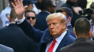 (FILES) Former US president Donald Trump arrives ahead of his arraignment at the Manhattan Criminal Court in New York on April 4, 2023. Donald Trump was indicted on August 1, 2023 over his efforts to overturn the results of the 2020 election -- the most serious legal threat yet to the former president as he campaigns to return to the White House. (Photo by ANGELA WEISS / AFP)