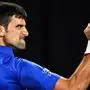 (FILES) This file photo taken on January 27, 2019 shows Serbia's Novak Djokovic reacting after a point against Spain's Rafael Nadal during the men's singles final on day 14 of the Australian Open tennis tournament in Melbourne. - World number one Novak Djokovic was among the entries for the Australian Open on December 8, 2021, but women's great Serena Williams was missing. (Photo by SAEED KHAN / AFP) / -- IMAGE RESTRICTED TO EDITORIAL USE - STRICTLY NO COMMERCIAL USE --