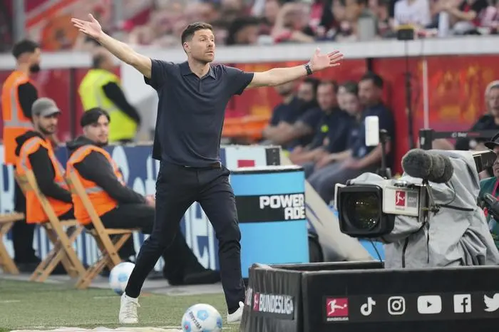 Leverkusen's head coach Xabi Alonso reacts during the German Bundesliga soccer match between Bayer Leverkusen and Union Berlin at the BayArena in Leverkusen, Germany, Saturday, April 12, 2025. (AP Photo/Martin Meissner)