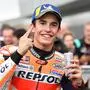 Repsol Honda Team rider Marc Marquez of Spain celebrates his pole position at the parc ferme after the MotoGP qualifying session of the Japanese motorcyle Grand Prix at the Twin Ring Motegi circuit in Motegi, Tochigi prefecture on October 19, 2019. (Photo by Toshifumi KITAMURA / AFP)