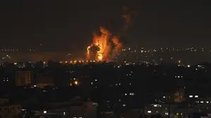 Fire and smoke rise following an Israeli airstrike in central Gaza Strip, Friday, April 7, 2023. The Israeli military has struck targets in the Gaza Strip, pushing the region toward a wider conflagration after a day of rocket fire along the country's northern and southern borders. The fighting follows two days of unrest at Jerusalem's most sensitive holy site. As Israeli aircraft began striking Gaza, Palestinian militants quickly fired off a new barrage of rockets, setting off air raid sirens across southern Israel. (AP Photo/Fatima Shbair)