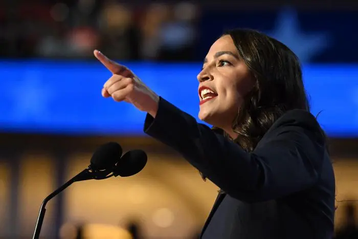 TOPSHOT - US Representative Alexandria Ocasio-Cortez (D-NY) speaks on the first day of the Democratic National Convention (DNC) at the United Center in Chicago, Illinois, on August 19, 2024. Vice President Kamala Harris will formally accept the party’s nomination for president at the DNC which runs from August 19-22 in Chicago. (Photo by ANDREW CABALLERO-REYNOLDS / AFP)