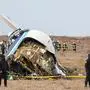 Emergency specialists work at the crash site of an Azerbaijan Airlines passenger jet near the western Kazakh city of Aktau on December 25, 2024. (Photo by Issa Tazhenbayev / AFP)