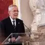 Austrian President Alexander Van der Bellen smiles during his speech at the swearing-in ceremony of the Federal Government in the presidential office at the Hofburg Palace, in Vienna, Austria, Monday, March 3, 2025. (AP Photo/Denes Erdos)