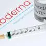 (FILES) This file picture taken on November 18, 2020 shows a syringe and a bottle reading "Vaccine Covid-19" next to the Moderna biotech company logo. - US biotechnology firm Moderna on January 25, 2021 said lab studies showed its Covid-19 vaccine would remain protective against variants of the coronavirus first identified in the United Kingdom and South Africa. "The study showed no significant impact" on the level of neutralizing antibodies elicited against the UK variant, B.1.1.7. (Photo by JOEL SAGET / AFP) / -- IMAGE RESTRICTED TO EDITORIAL USE - STRICTLY NO COMMERCIAL USE --