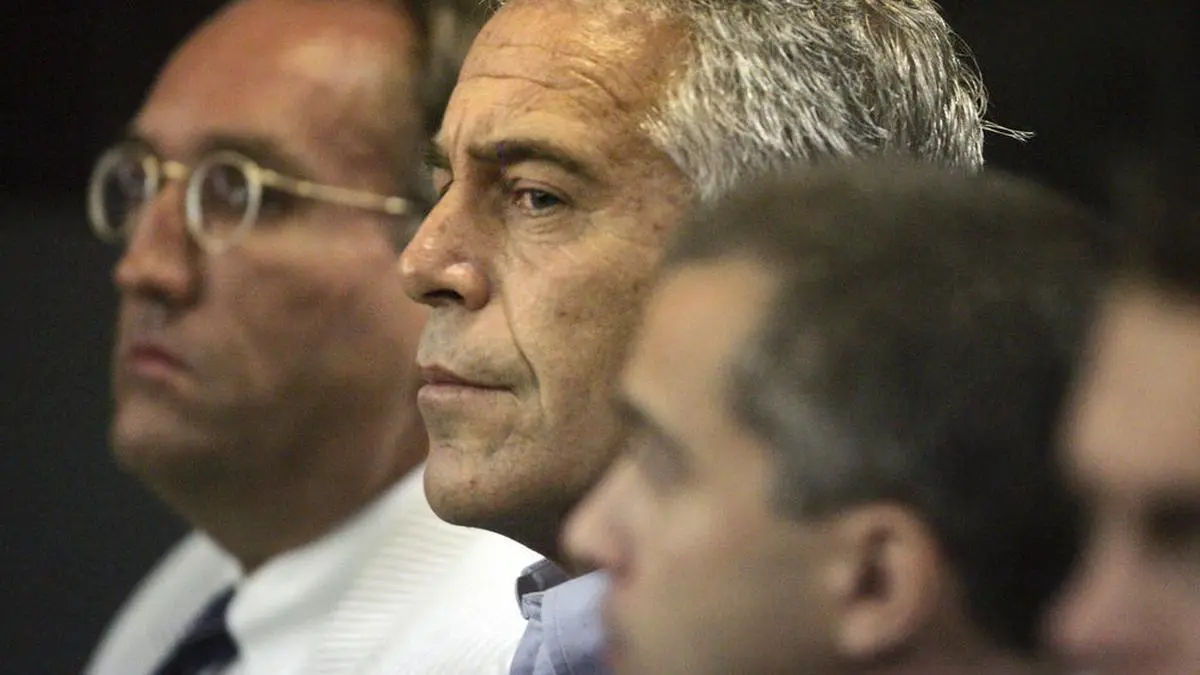 FILE- In this July 30, 2008 file photo, Jeffrey Epstein is shown in custody in West Palm Beach, Fla. Labor Secretary nominee Alexander Acosta is expected to face questions at his Senate confirmation hearing about an unusual plea deal he oversaw for Epstein, a Florida billionaire and sex offender, as U.S. attorney in Miami.  Federal prosecutors say a once-secret plea deal reached over a decade ago with Epstein must stand, despite objections from many of his victims. Prosecutors said in a new court filing that a violation of the Crime Victims’ Rights Act does not allow for the agreement to be voided. (Uma Sanghvi/Palm Beach Post via AP)