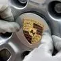 ARCHIV - Ein Arbeiter montiert am 2. Juni 2009 das Logo an einem Rad eines Porsche Panamera im Porschewerk in Leipzig. Der Porsche-Aufsichtsrat will in den kommenden Wochen eine Grundsatzentscheidung ueber einen moeglichen Einstieg des Emirats Katar bei dem hoch verschuldeten Autobauers treffen. Die Familie Porsche-Piech, die bisher 100 Prozent der Stammaktien haelt, muesste dann erstmals fremde Mitsprache dulden. (AP Photo/Eckehard Schulz)  --- FILE - A worker assembles the Porsche logo at a new car Porsche Panamera at the plant in Leipzig, eastern Germany, Tuesday, June 2, 2009. The German car sport car manufacturer Porsche AG starts the series production of this new four-door sport sedan. (AP Photo/Eckehard Schulz)