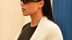 Kim Kardashian exits the Ritz hotel on her way to the Balenciaga show during Paris Fashion Week