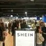 Costumers shops on the opening day of Asian e-commerce giant Shein's first physical store at the Bazar de l'Hotel de Ville (BHV) department store in Paris on November 5, 2025. (Photo by Dimitar DILKOFF / AFP)