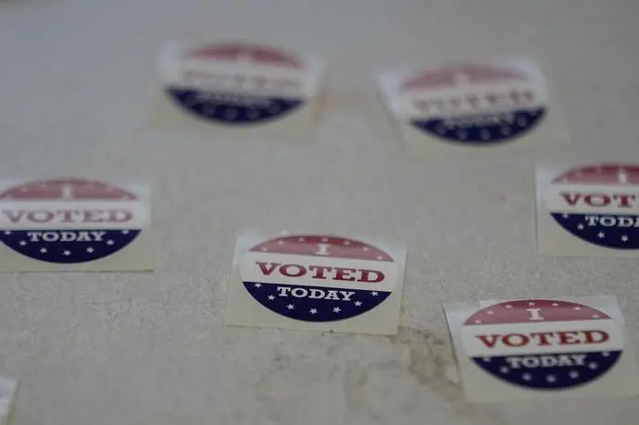 Stickers are available for voters at a polling place Tuesday, March 5, 2024, in Nashville, Tenn. Super Tuesday elections are being held in 16 states and one territory. Hundreds of delegates are at stake, the biggest haul for either party on a single day. (AP Photo/George Walker IV)