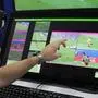 FILE - A referee demonstrates a video operation room, a facility of the Video Assistant Referee (VAR) system which will be rolled out for the first time during the World Cup, in Moscow, Russia, on June 9, 2018. VAR - the high-tech video review system formally written into the laws of soccer in 2018 to, in theory, help referees make the right calls in the biggest moments. (AP Photo/Dmitri Lovetsky, File)
